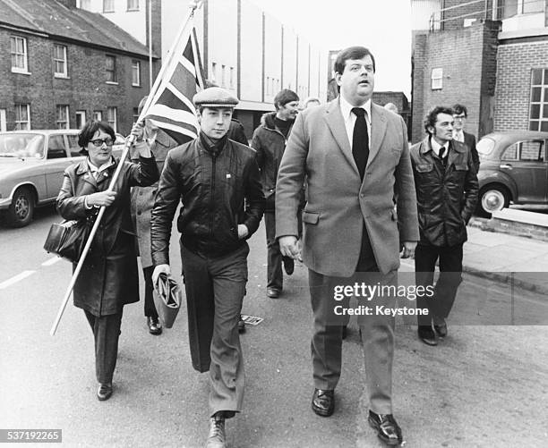 National Front leader Martin Webster leaving Kingston Crown Court with his followers, where he was given a suspended sentence for publishing material...