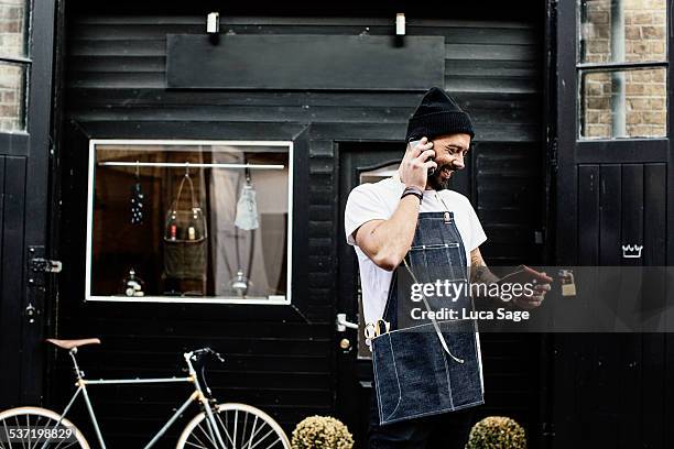 small business owner outside his shop - small business exterior stock pictures, royalty-free photos & images