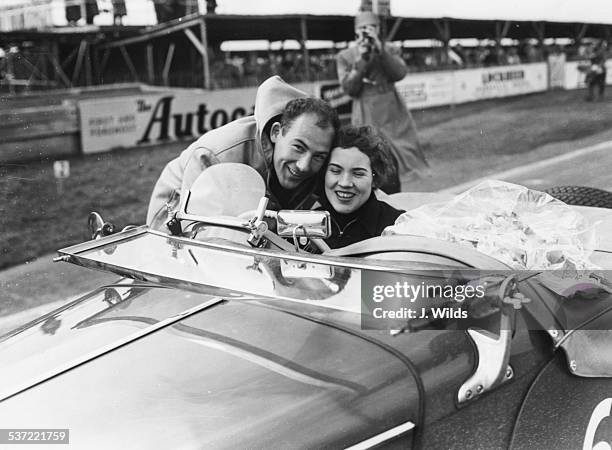 Racing driver Stirling Moss congratulating his sister Pat Moss as she wins the Ladies Handicap at the Goodwood Circuit, England, 1955.