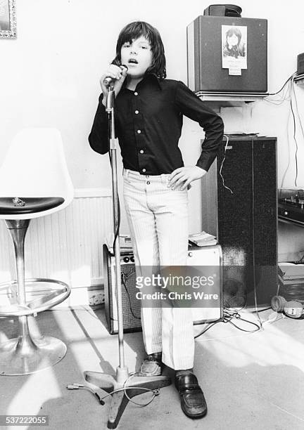 Portrait of pop singer Ricky Wilde rehearsing in a studio, circa 1972.