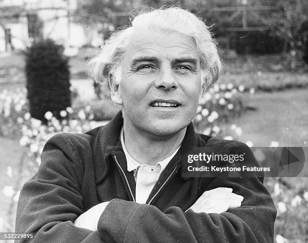 Portrait of actor and dramatist Emlyn Williams in a garden, circa 1960.