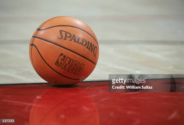 Detail of the ball on the floor during the NBA game between the Denver Nuggets and the Sacramento Kings at the Pepsi Center in Denver, Colorado. The...