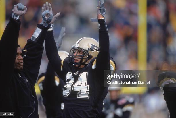 Niko Koutouvides of the Purdue Boilermakers signals the touch down from the sidelines during the game against the Northwestern Wildcats at Ross-Ade...
