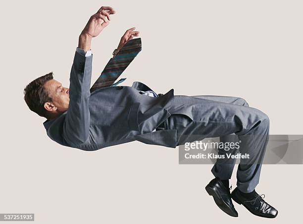 businessman in the air, falling down - in der luft schwebend stock-fotos und bilder