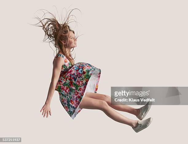woman in dress in the air, falling down - cadere foto e immagini stock