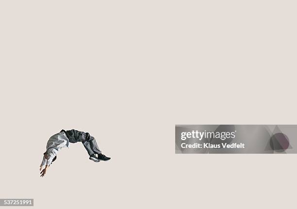 man doing backflip in the air, in large space - up in the air stock pictures, royalty-free photos & images