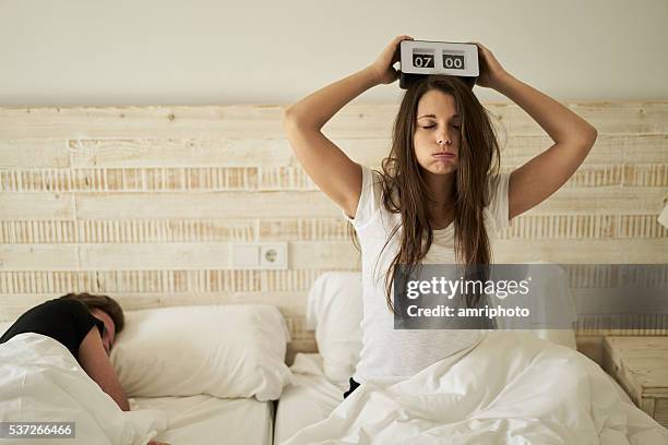 woman in bed with burnout - number 7 clock stock pictures, royalty-free photos & images