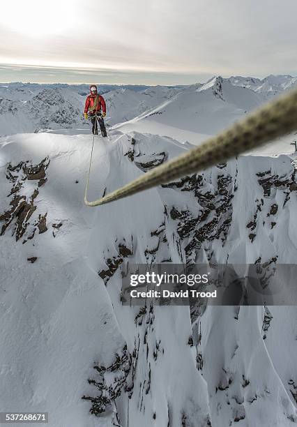 mountain climber on a ridge in the austrian alps - abyss stock-fotos und bilder