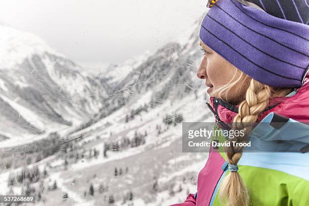 young woman in ski lift in the austrian alps - woman on ski lift stock pictures, royalty-free photos & images
