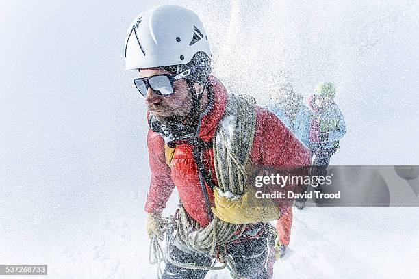 trekking in a blizzard in the austrian alps - tour 2014 stock pictures, royalty-free photos & images