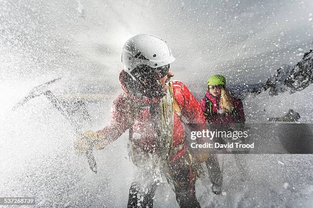 trekking in a snow storm in the austrian alps - ice axe stock pictures, royalty-free photos & images