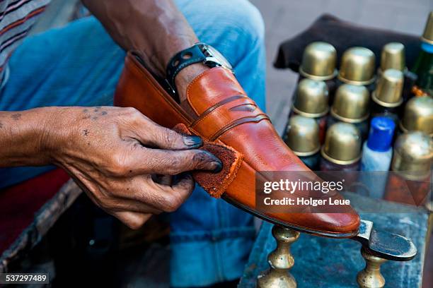 shoe shine in pedestrian zone - shoe polish stock pictures, royalty-free photos & images