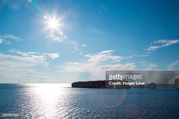 islands and coastline with afternoon sun - sun flare clouds sky stock pictures, royalty-free photos & images