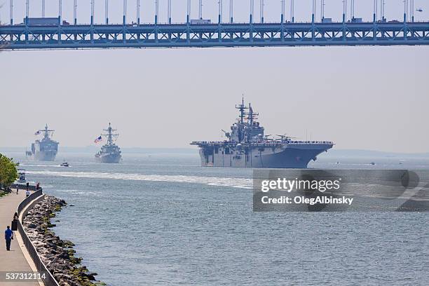 nyc fleet week 2016, warships entering new york harbor. - new bay bridge stock pictures, royalty-free photos & images