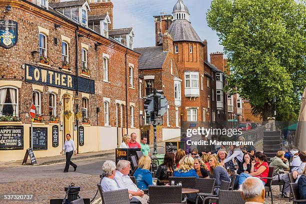 people near a restaurant - york england fotografías e imágenes de stock