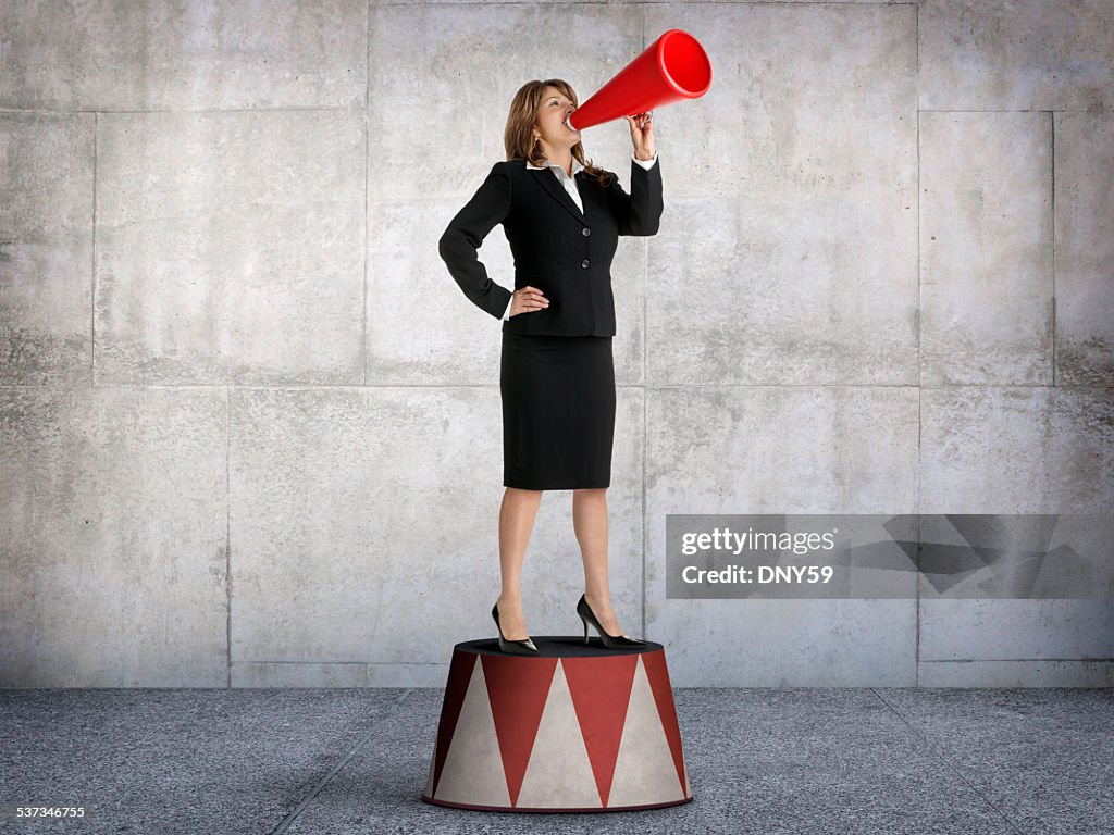 Businesswoman Shouting From Pedestal