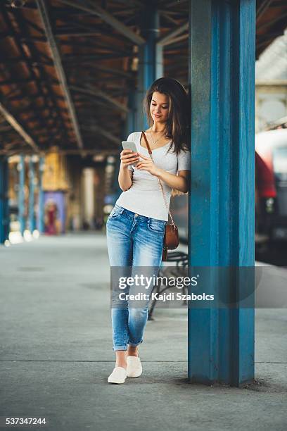 young girl waiting the train - budapest train stock pictures, royalty-free photos & images