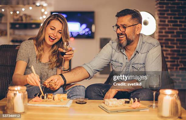 they love spending time together - holding chopsticks stock pictures, royalty-free photos & images