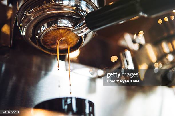 espresso machine pulling a shot - coffees stock pictures, royalty-free photos & images