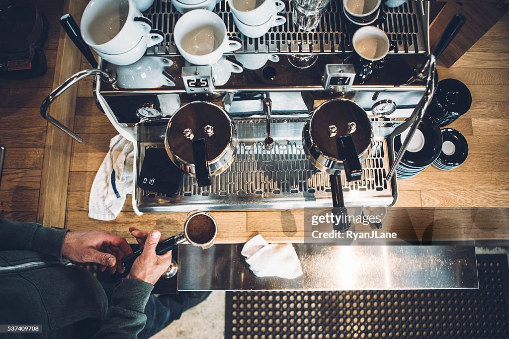 Barista Working on Espresso Machine