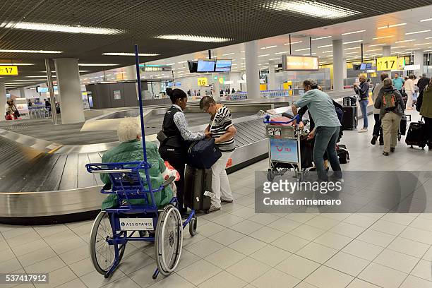 assitance service at schipol airport - amsterdam airport stock pictures, royalty-free photos & images