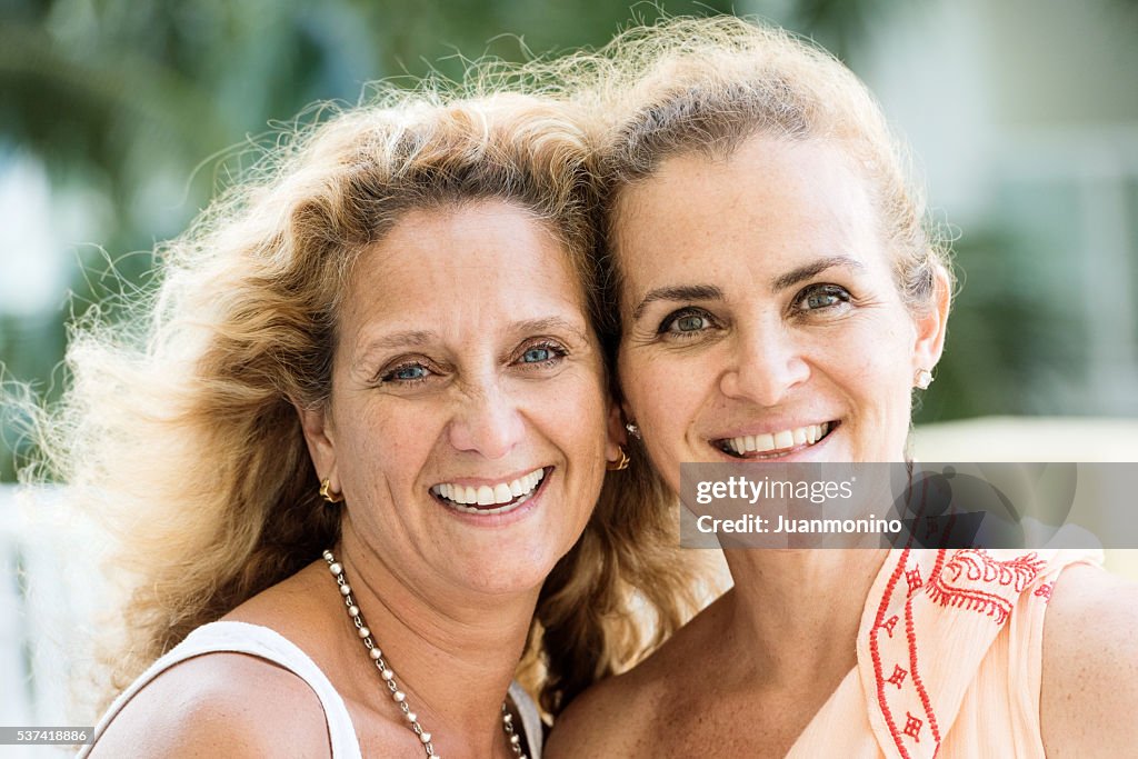 Smiling mature caucasian siblings