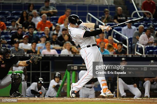 Chris Johnson of the Miami Marlins hits a base hit in the second inning of the game between the Miami Marlins and the Pittsburgh Pirates at Marlins...