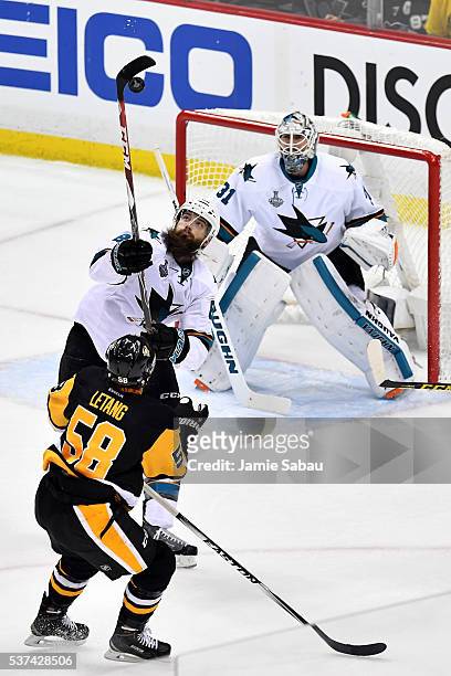 Brent Burns of the San Jose Sharks handles the puck in the air during the first period against the Pittsburgh Penguins in Game Two of the 2016 NHL...