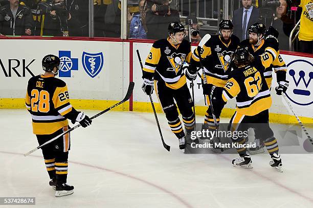 Phil Kessel of the Pittsburgh Penguins celebrates with teammates after scoring a second period goal against Martin Jones of the San Jose Sharks in...