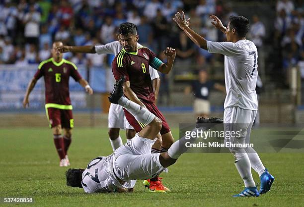 Tomas Rincon of Venezuela and Carlos Humberto Ruiz Gutierrez of Guatamala fight for the ball during a game against Guatamala at Lockhart Stadium on...