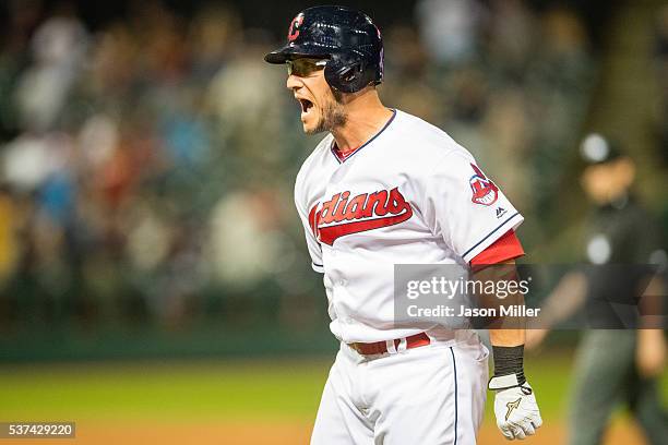 Yan Gomes of the Cleveland Indians celebrates after hitting a walk-off RBI single scoring Lonnie Chisenhall during the eleventh inning against the...