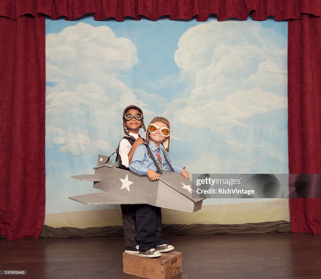 Young Children Dressed as Busnissmen in Toy Airplane