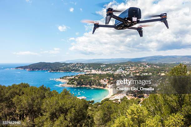 dron drone coast beach summer clouds sun horizontal bebop parrot - remote control helicopter stock pictures, royalty-free photos & images