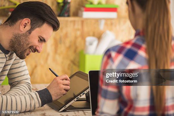young man and woman working at modern office - animator stock pictures, royalty-free photos & images