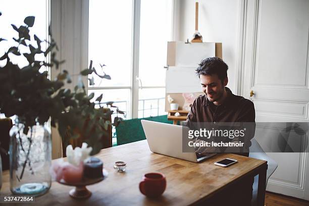 young man working at home - teleworking hipster stock pictures, royalty-free photos & images