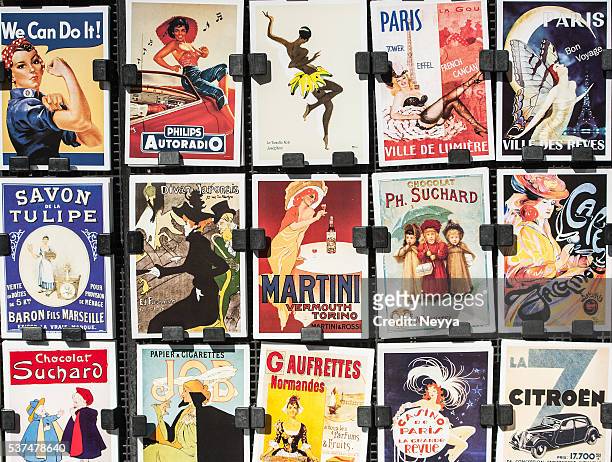 vintage posters and advertisements for sale at traditional bookstall, paris - fashion show bildbanksfoton och bilder