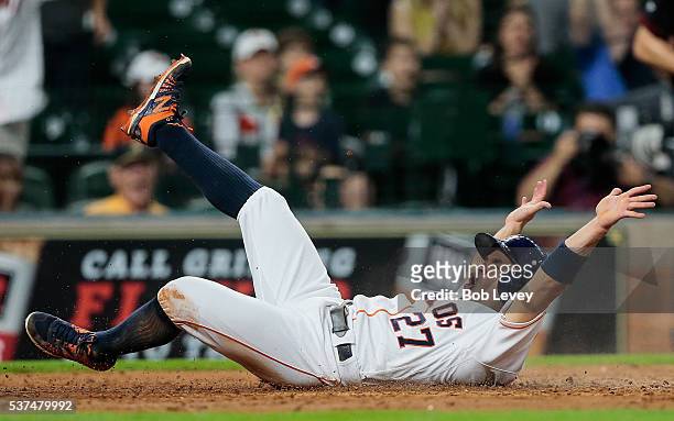 Jose Altuve of the Houston Astros scores in the fifth inning on a single by Carlos Correa against the Arizona Diamondbacks at Minute Maid Park on...