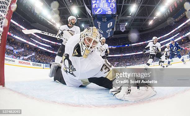 Goalie Matt Murray of the Pittsburgh Penguins stretches to make a save against the Tampa Bay Lightning during Game Four of the Eastern Conference...
