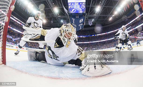 Goalie Matt Murray of the Pittsburgh Penguins stretches to make a save against the Tampa Bay Lightning during Game Four of the Eastern Conference...