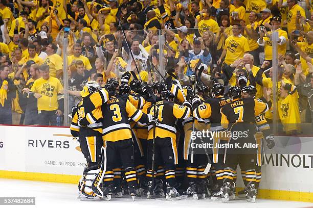 Conor Sheary of the Pittsburgh Penguins celebrates with teammates after scoring the game-winning goal to defeat the San Jose Sharks 2-1 during...