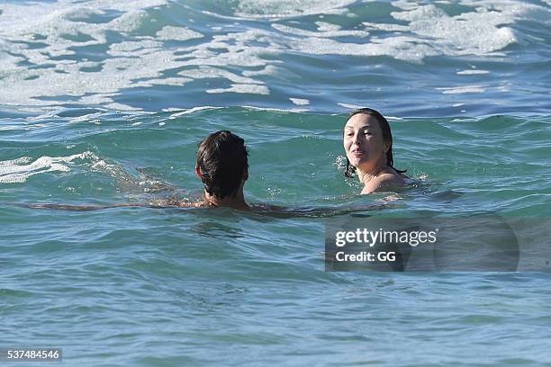 Former NRL player, Andrew Johns displays his surfing skills while on a beach outing with a female friend on May 24, 2016 in Sydney, Australia.