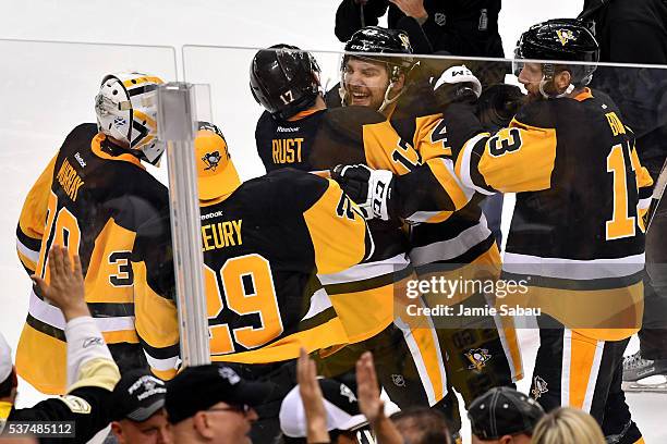 Conor Sheary of the Pittsburgh Penguins celebrates with teammates after scoring the game-winning goal to defeat the San Jose Sharks 2-1 during...