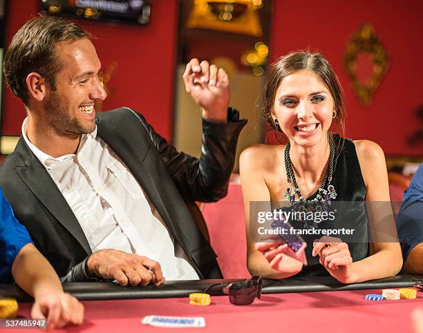 friends playing at poker at casino - blackjacks stock pictures, royalty-free photos & images