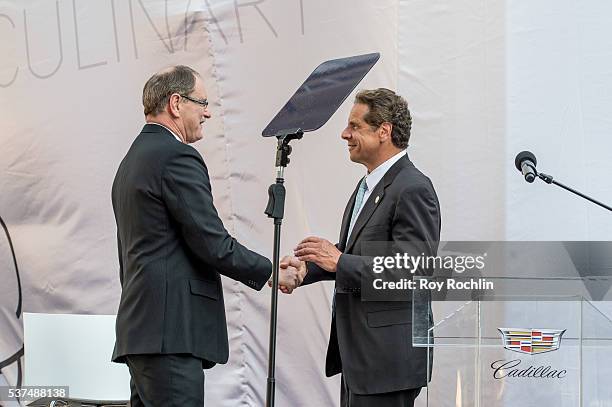 Executive Vice President of General Motors and President at Global Cadillac Johan de Nysschen with NY Governor Andrew Cuomo speak during the Cadillac...