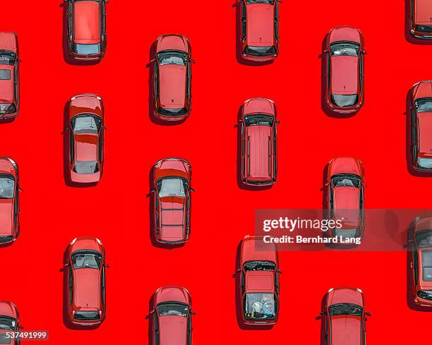 red cars on red underground, aerial view - auto rot stock-fotos und bilder