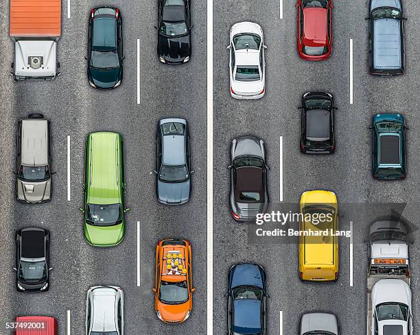 colored cars on traffic lanes, aerial view - autoverkehr stock-fotos und bilder