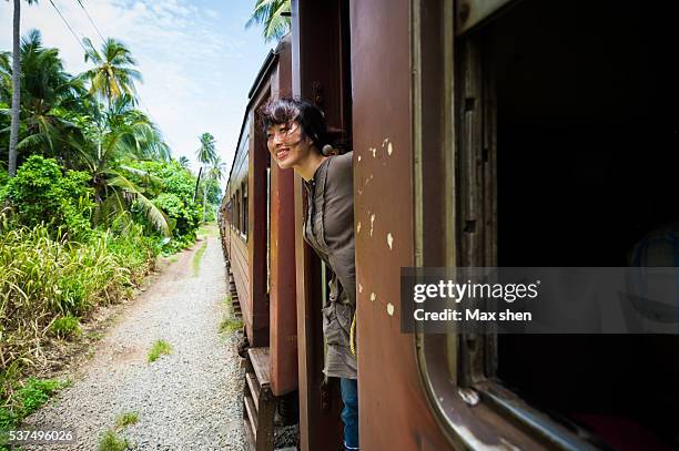 chinese tourist traveling in sri-lanka by train - sri lanka train stock pictures, royalty-free photos & images