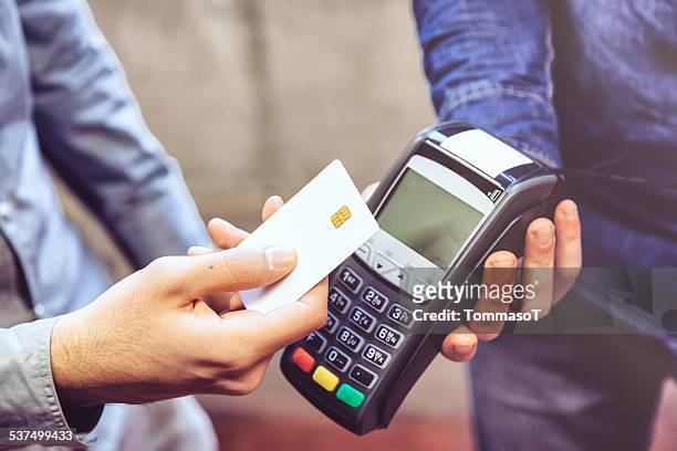 contactless payment - digital devices beside each other stockfoto's en -beelden