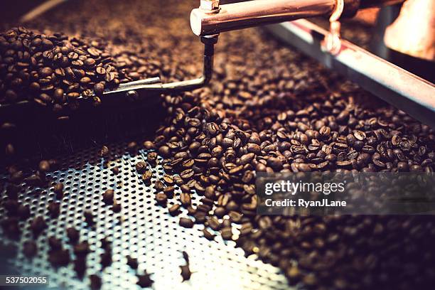 coffee roaster cooling batch of beans - fair trade stock pictures, royalty-free photos & images