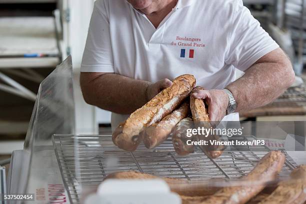 An illustrative picture showing the making of french baguettes in a bakery during the annual Bread Fair on May 21, 2016 in Paris, France.